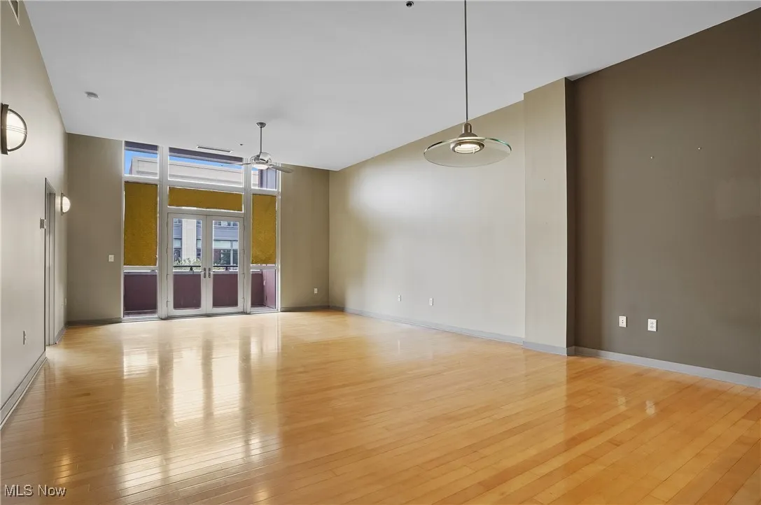 Spare room with a ceiling fan and wood-type flooring