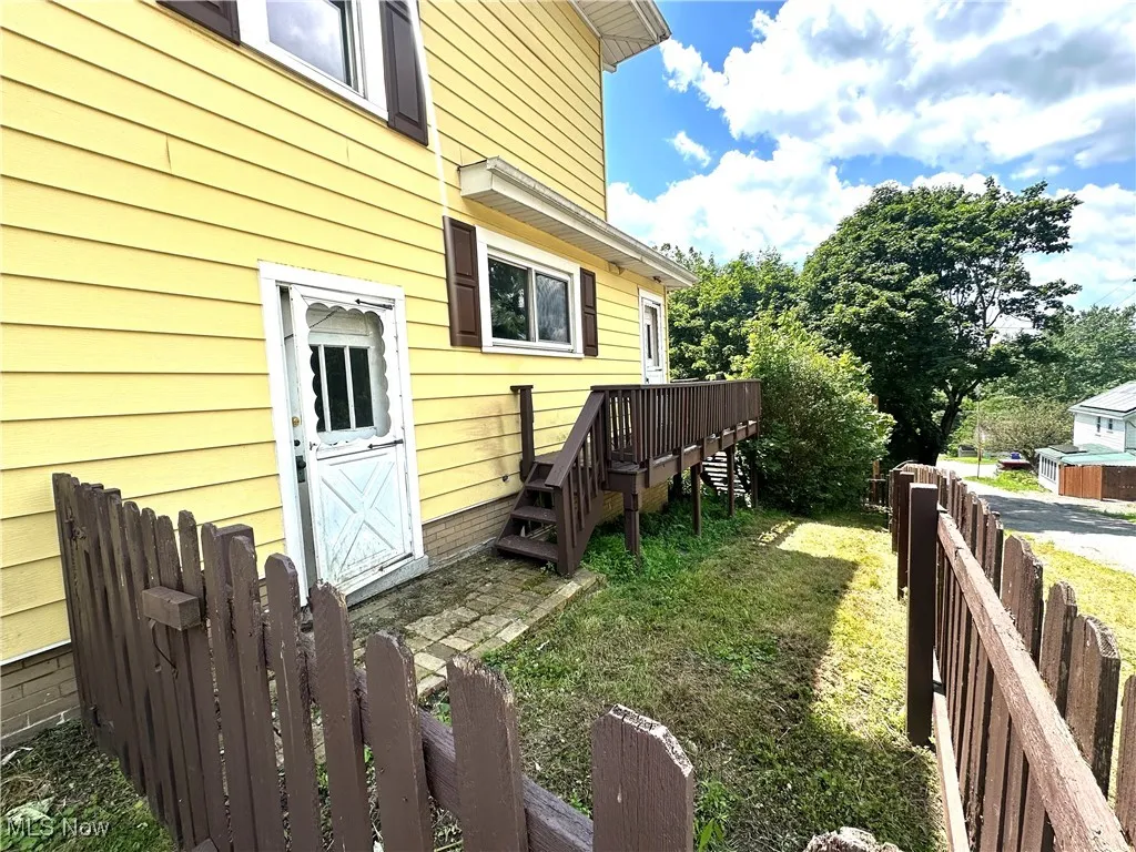 View of yard featuring stairway