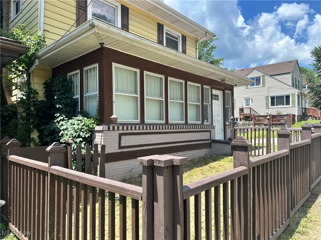 View of front facade featuring brick siding