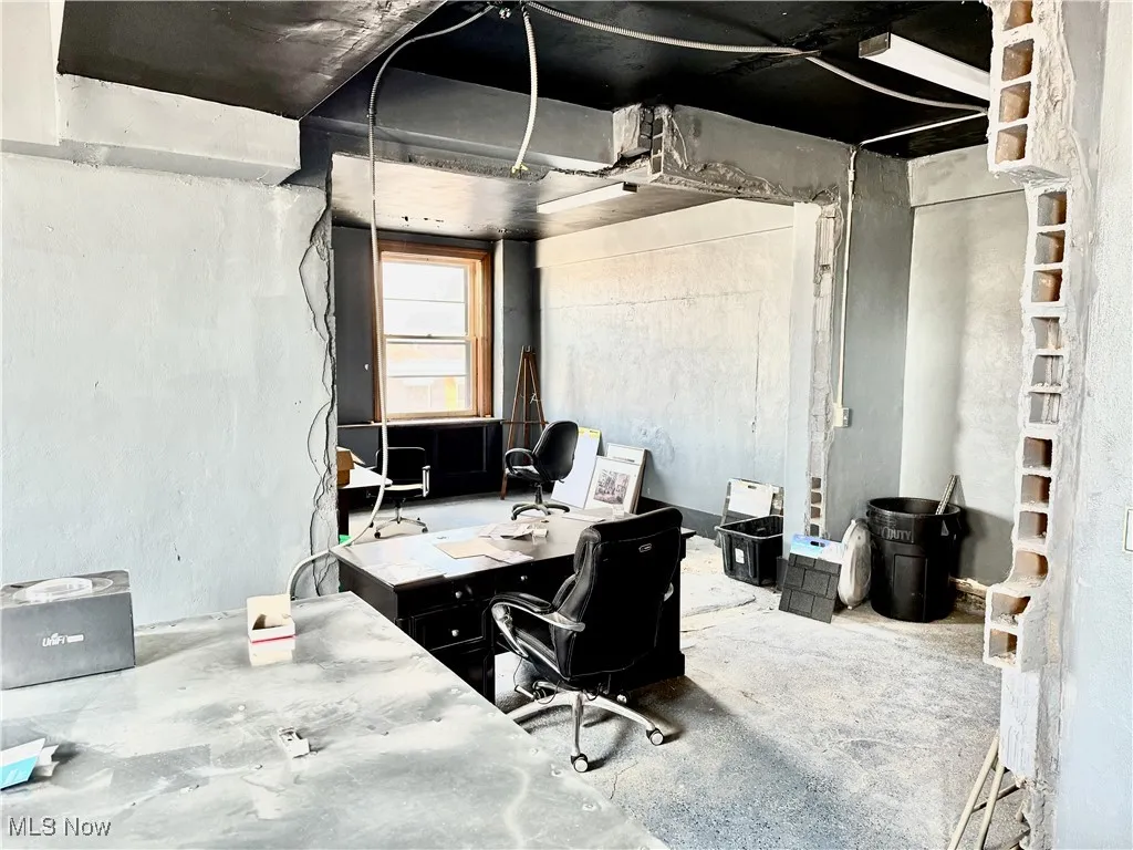 FIRST FLOOR OFFICE SPACE! THERE'S A RECEPTIONS DESK, A PRIVATE OFFICE, AND ROOM FOR A CONFERENCE TABLE.