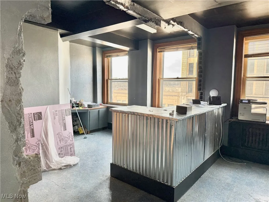 FIRST FLOOR OFFICE SPACE! THERE'S A RECEPTIONS DESK, A PRIVATE OFFICE, AND ROOM FOR A CONFERENCE TABLE.