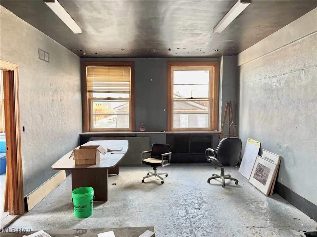 FIRST FLOOR OFFICE SPACE! THERE'S A RECEPTIONS DESK, A PRIVATE OFFICE, AND ROOM FOR A CONFERENCE TABLE.