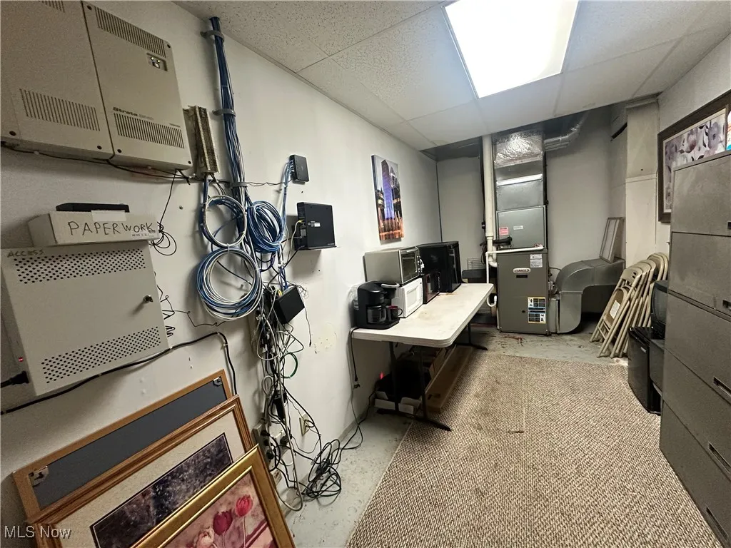 Office area with a drop ceiling and heating unit