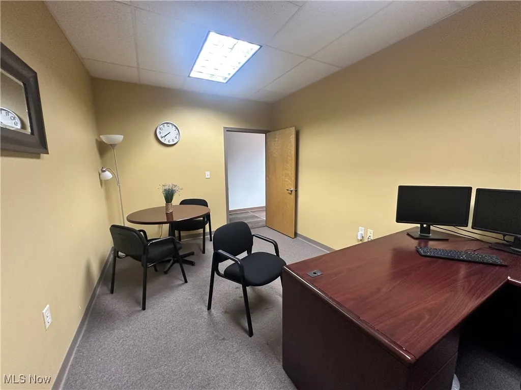 Office featuring carpet and a drop ceiling