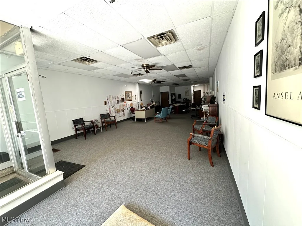 Common area with a drop ceiling