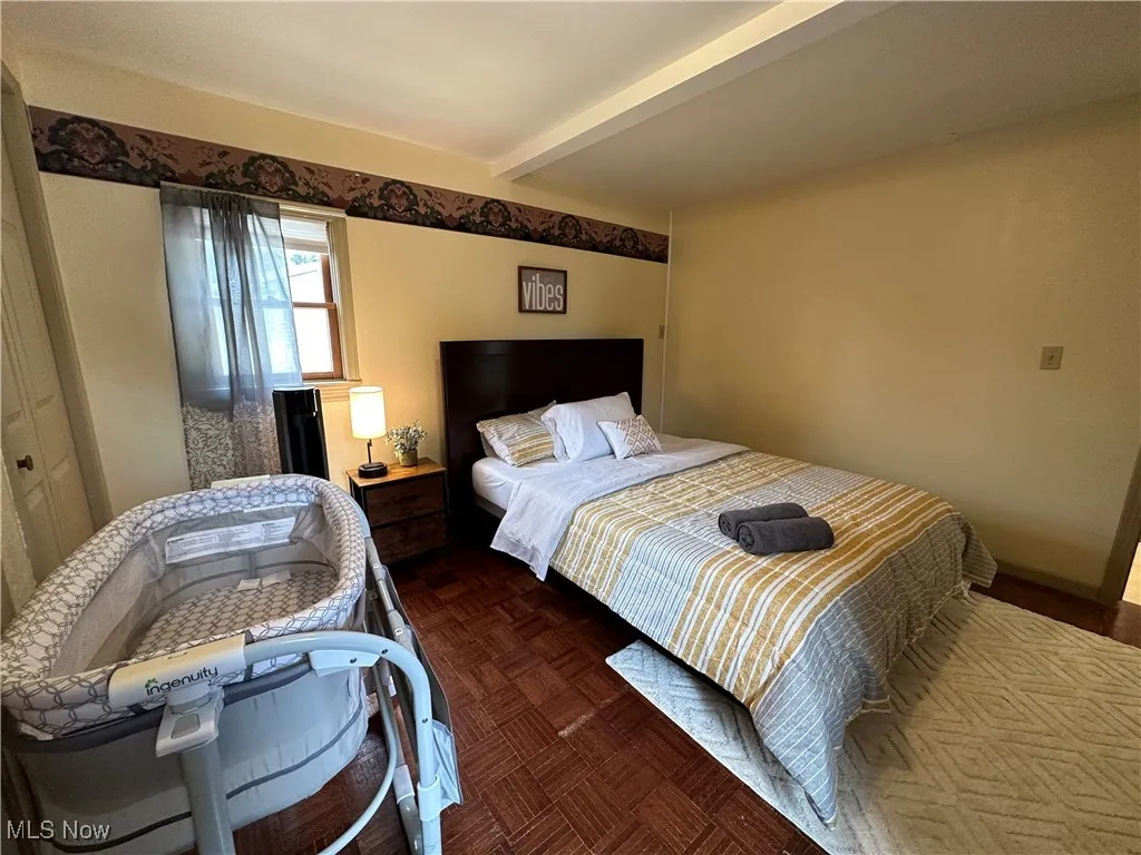 Bedroom with beamed ceiling