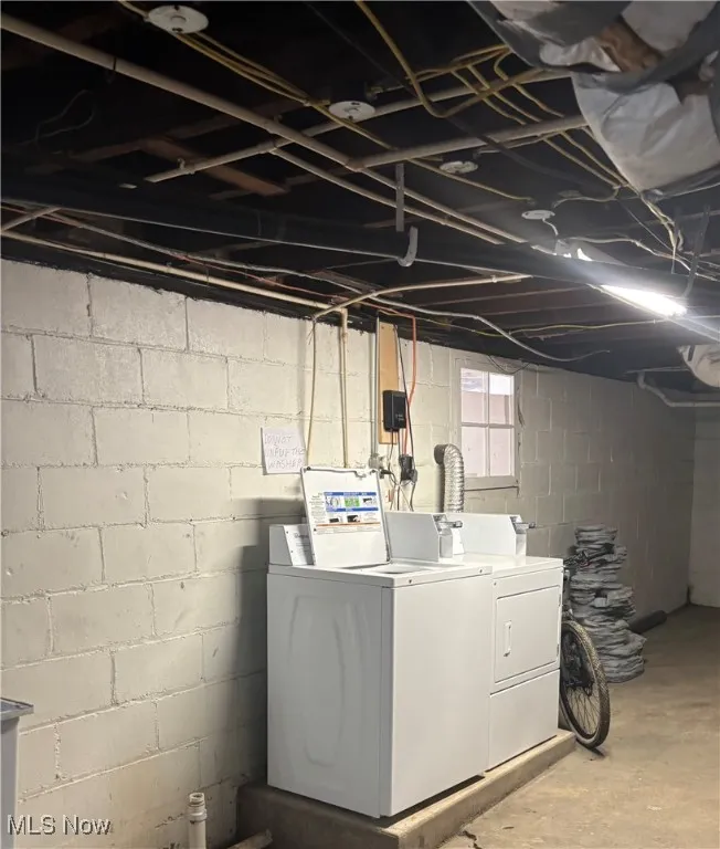 Washroom featuring laundry area and separate washer and dryer