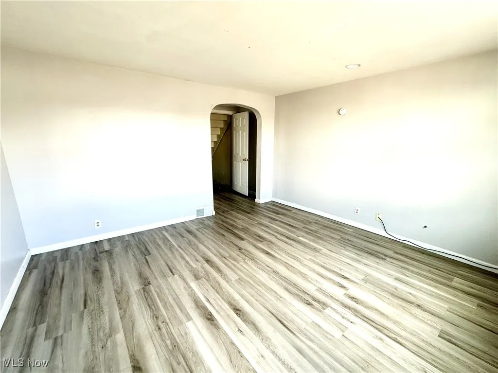Living room with arched walkway
