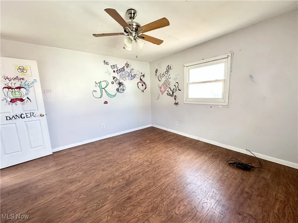 Bedroom featuring a ceiling fan