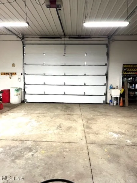 Newer garage door featuring a garage door opener