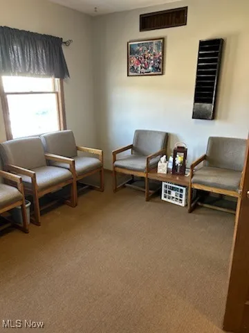 Waiting room featuring carpet flooring