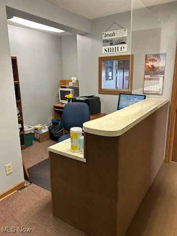 Office area featuring a textured ceiling and wood finished floors