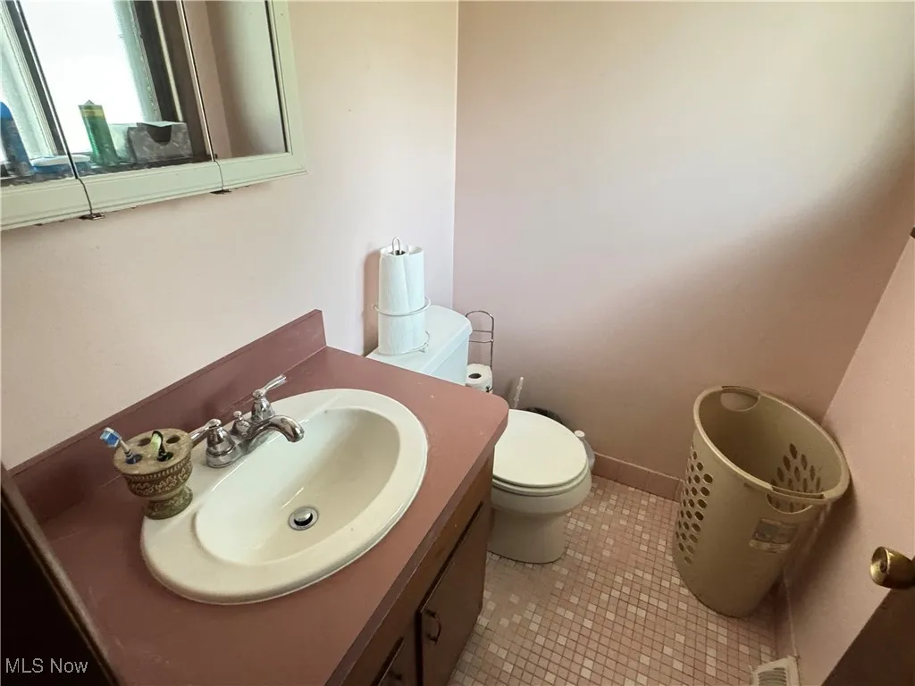 Bathroom featuring vanity and light tile patterned floors