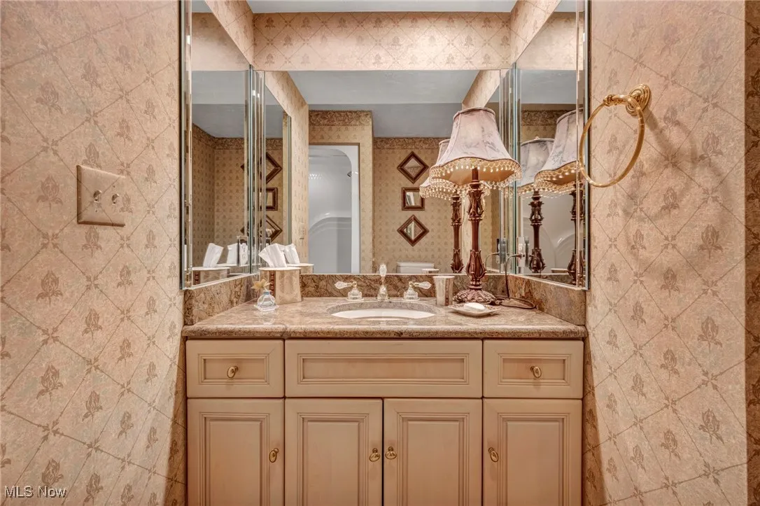 Glamour Bath with custom sink and gold plated faucets.