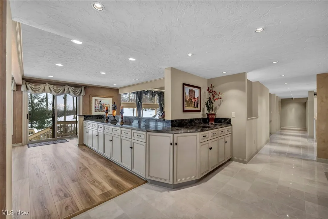 Buffett cabinetry houses 20' of storage with large drawers and cabinets with pull out shelves, wonderful storage for all your entertaining dinnerware!