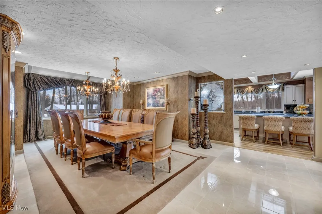 Dining Room features custom made stained glass window., inlaid custom designer carpet surrounded by marble flooring.