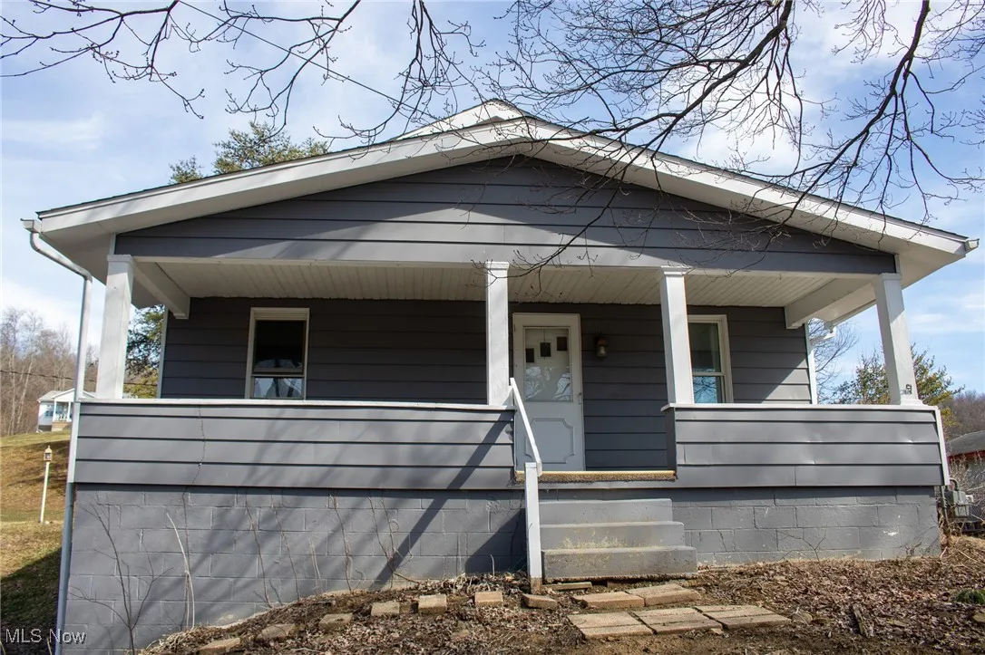 View of front of home featuring covered porch