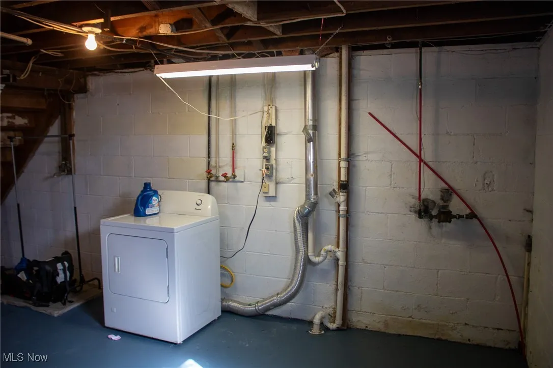 Washroom with laundry area and washer / clothes dryer
