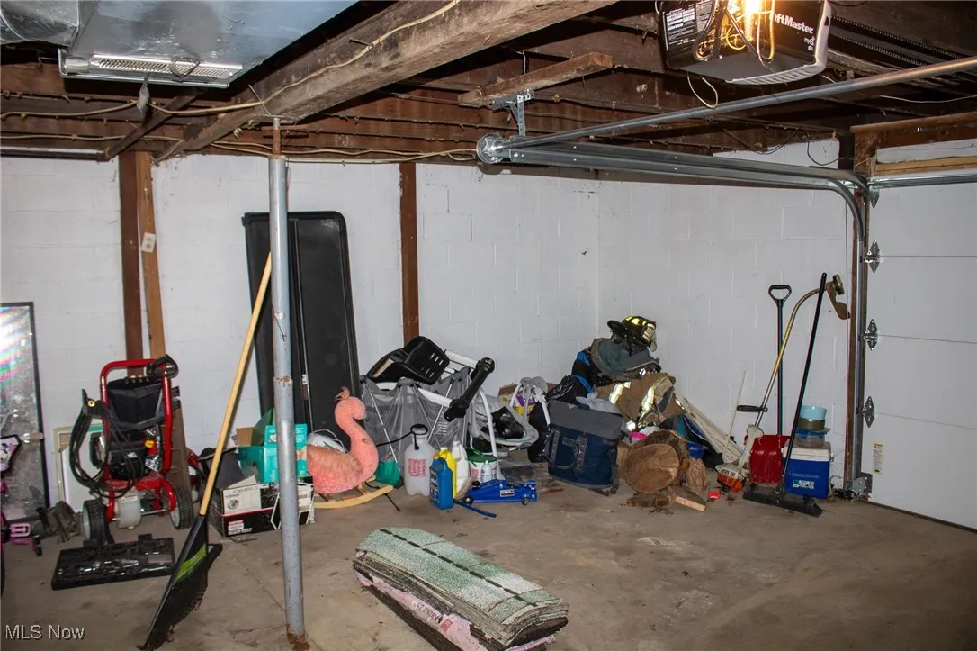 Garage featuring a garage door opener