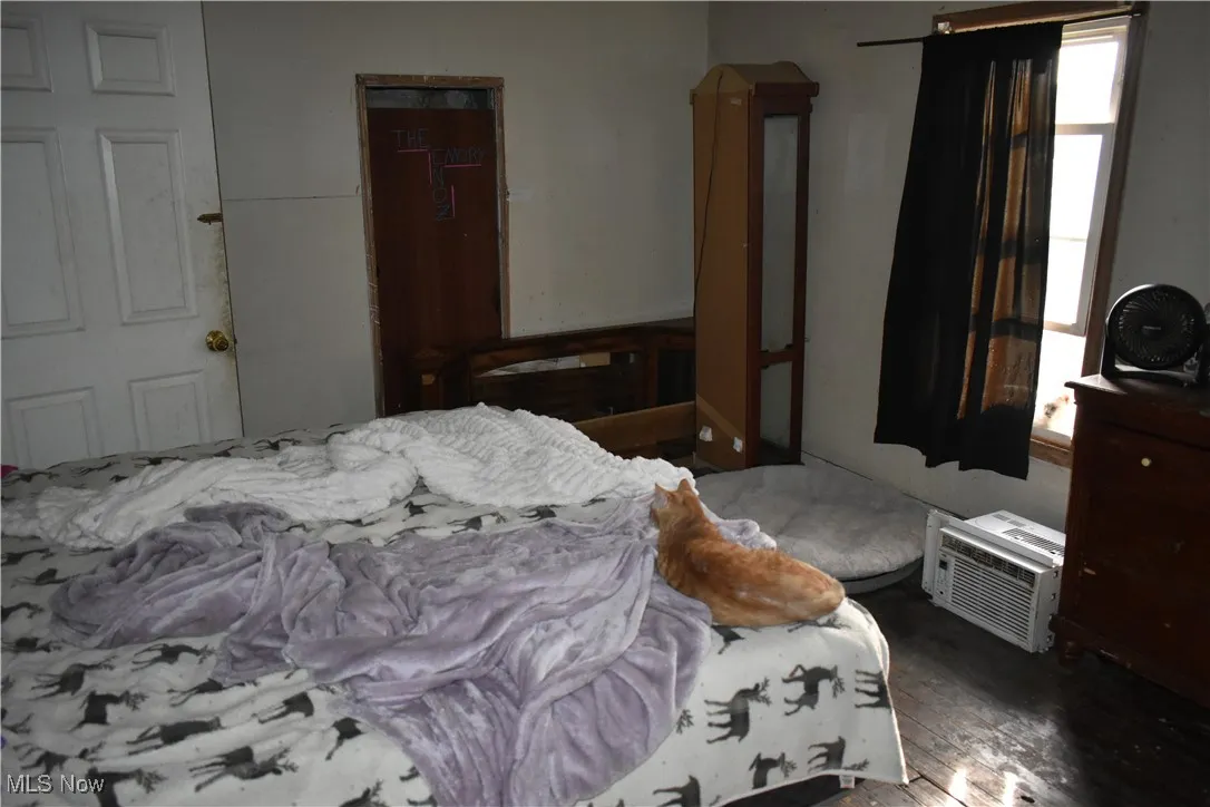 Bedroom with wood finished floors