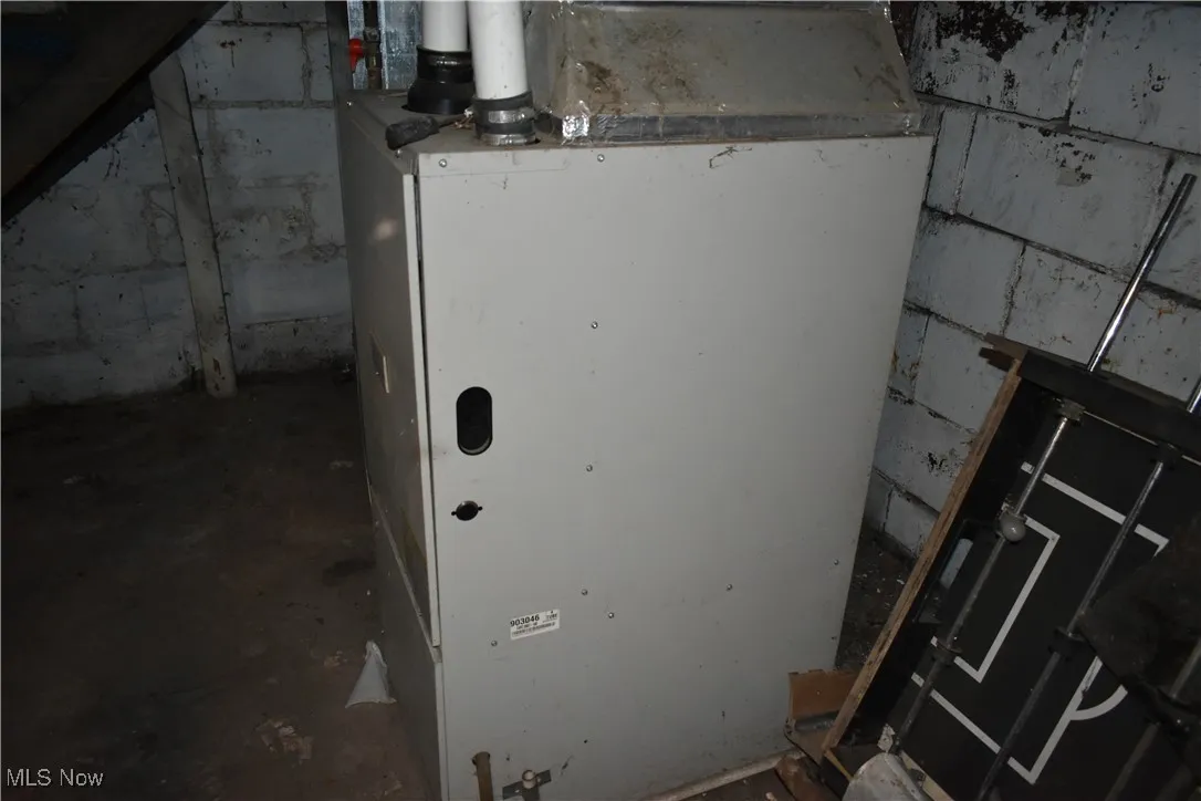 Utility room featuring heating unit