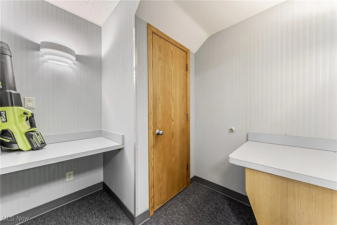 Bathroom featuring vaulted ceiling and​​‌​​​​‌​​‌‌​‌‌​​​‌‌​‌​‌​‌​​​‌​​ baseboards