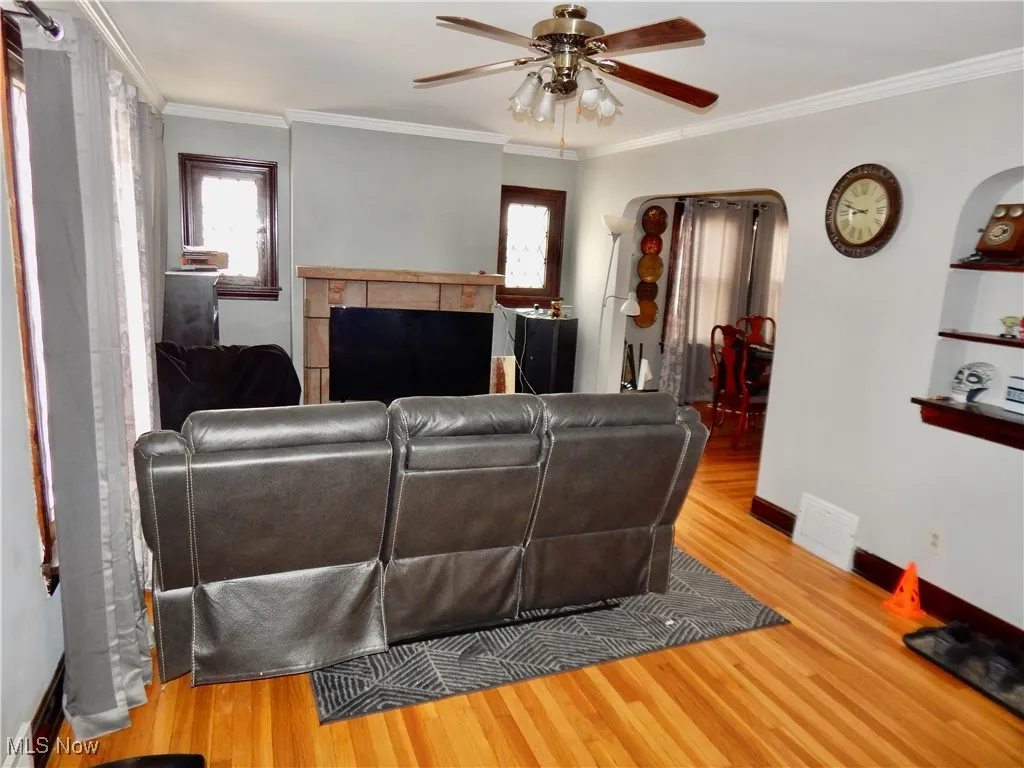 Upstairs unit Living area with hardwood floors, and a healthy amount of sunlight