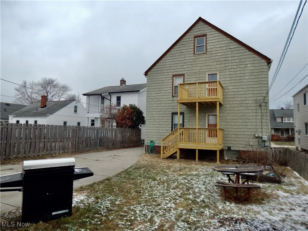 Back of property with fence and a brand new balcony