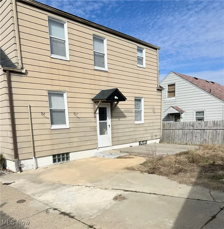 Back of house featuring fence and a patio