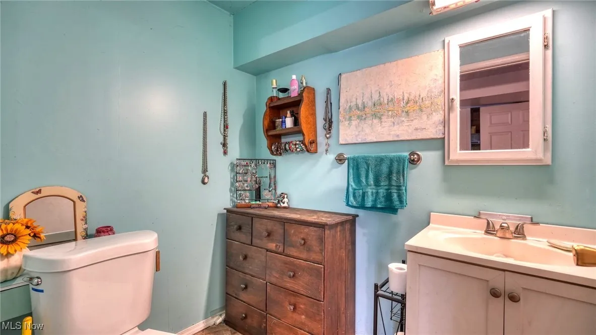 Bathroom with toilet and vanity