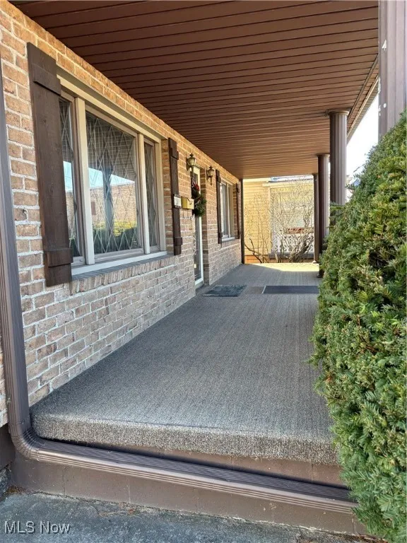 View of patio with a porch
