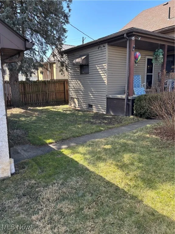 View of yard featuring fence