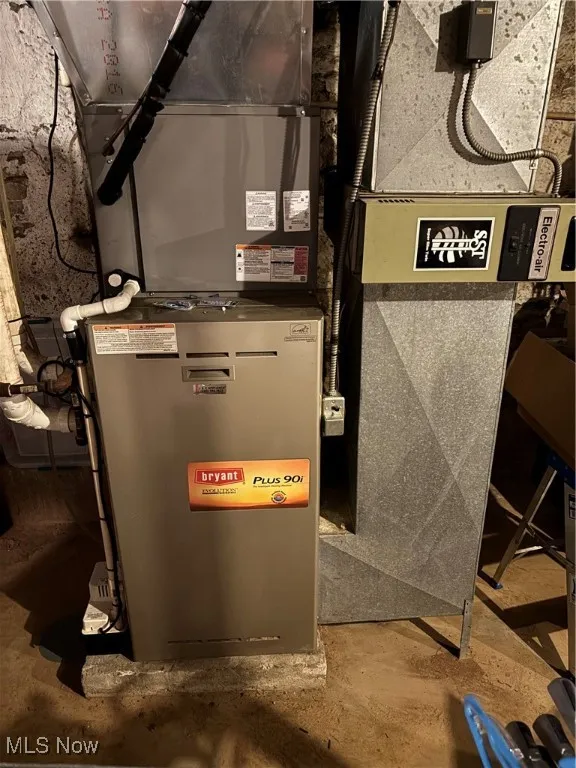 Utility room featuring heating unit