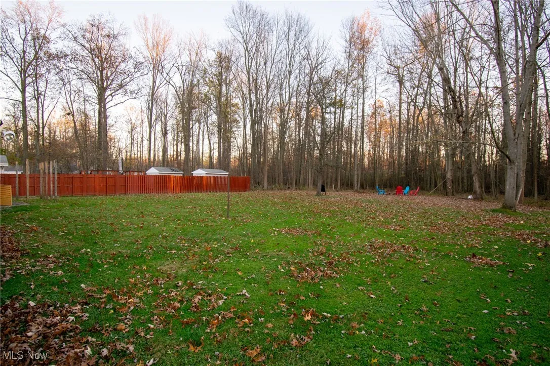 View of yard featuring fence