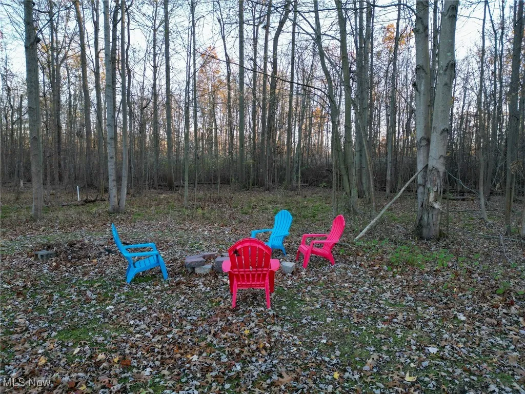 View of yard featuring a fire pit