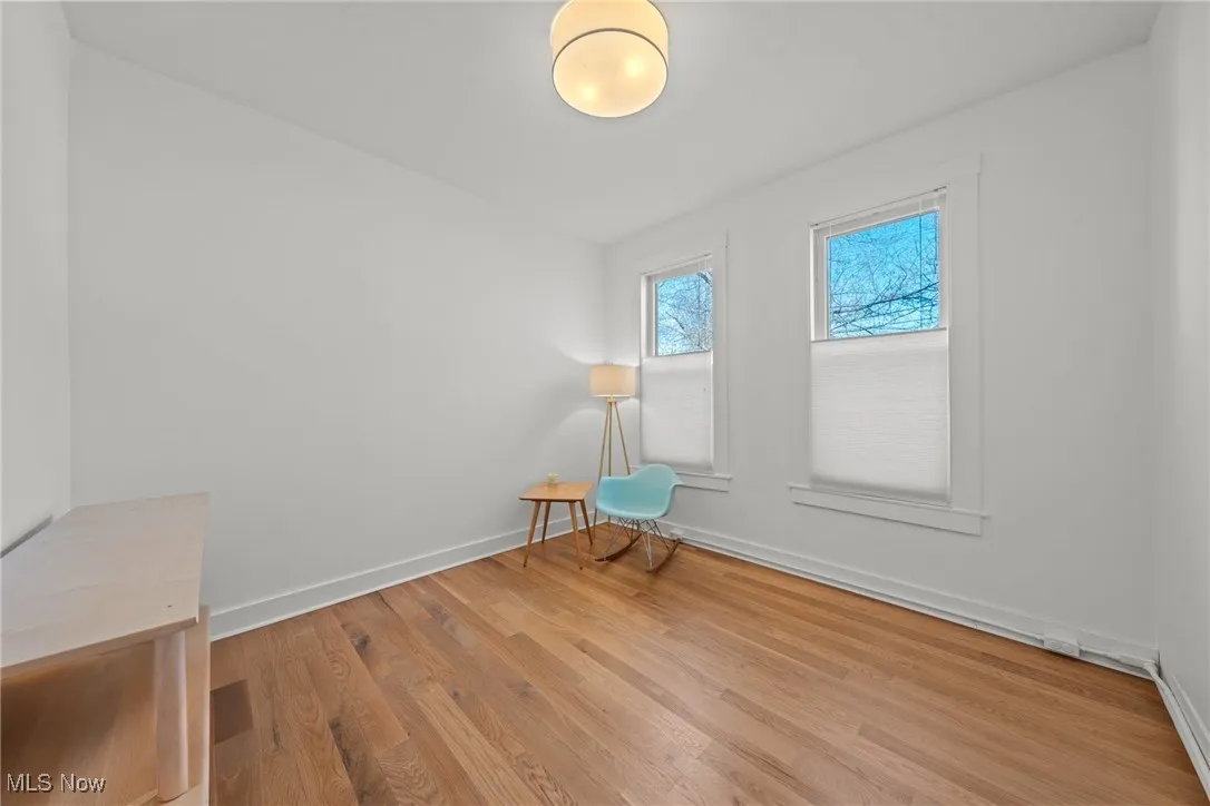 Unfurnished room with baseboards and wood finished floors
