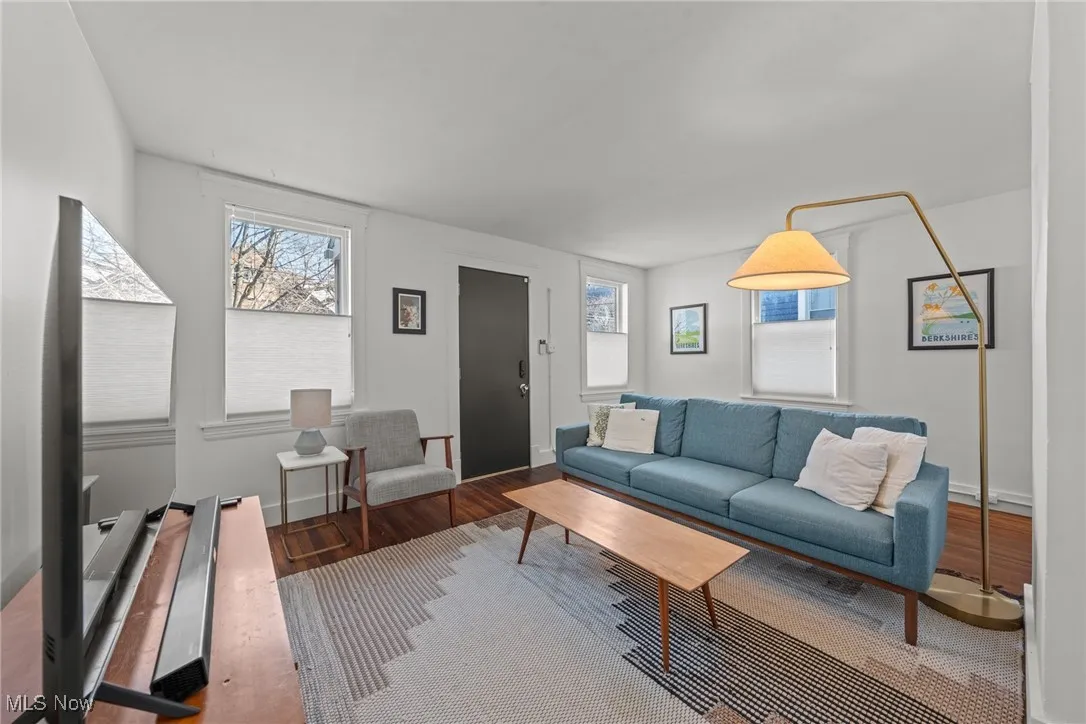 Living room with wood finished floors and baseboards