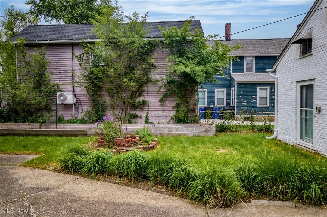 View of front of property with a chimney and roof with shingles