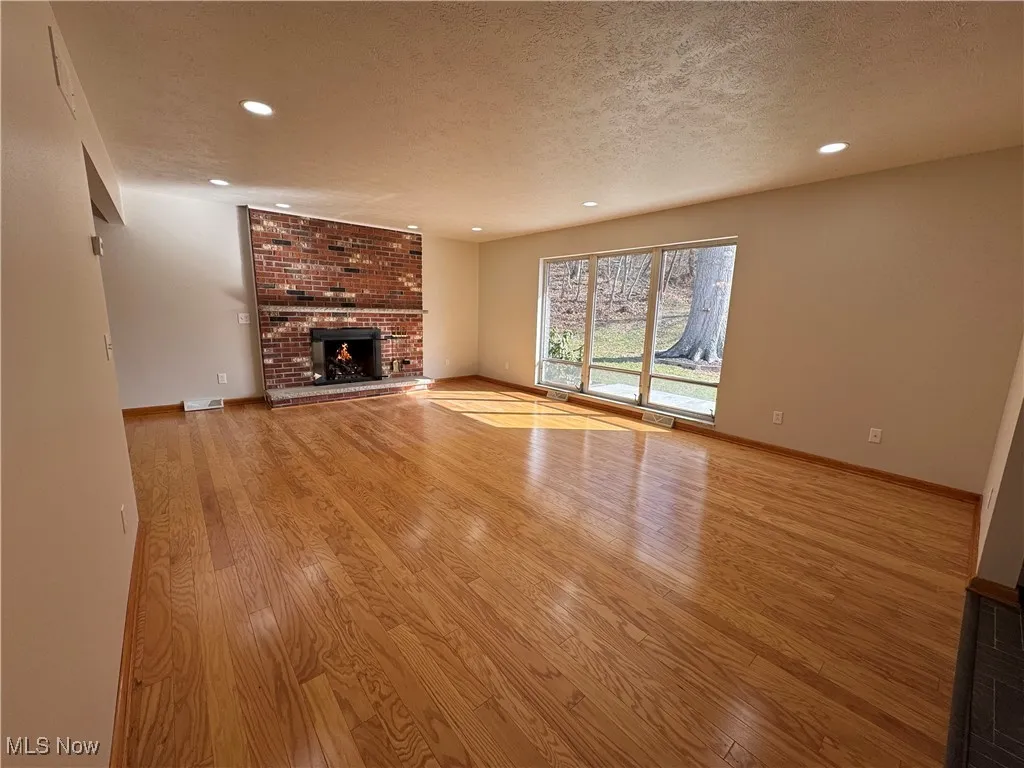Gas log Fireplace, beautiful harwoods and abundant natural light.