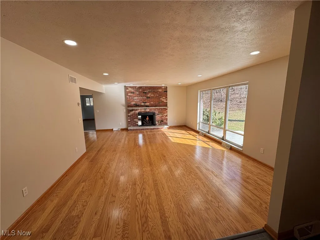 Beautiful hardwood floors, gas log fireplace, abundant natural lighting