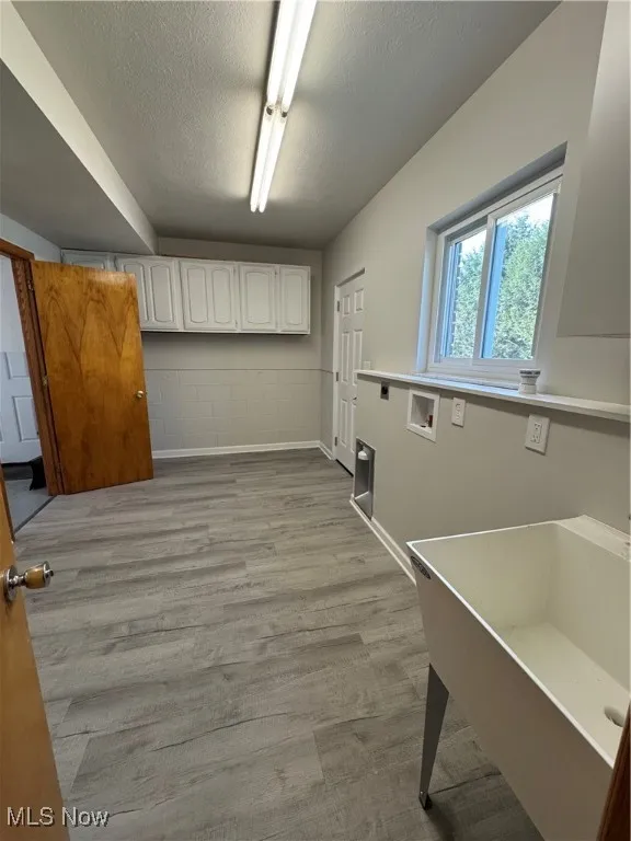 Super laundry room/mud room with rear door to the back yard