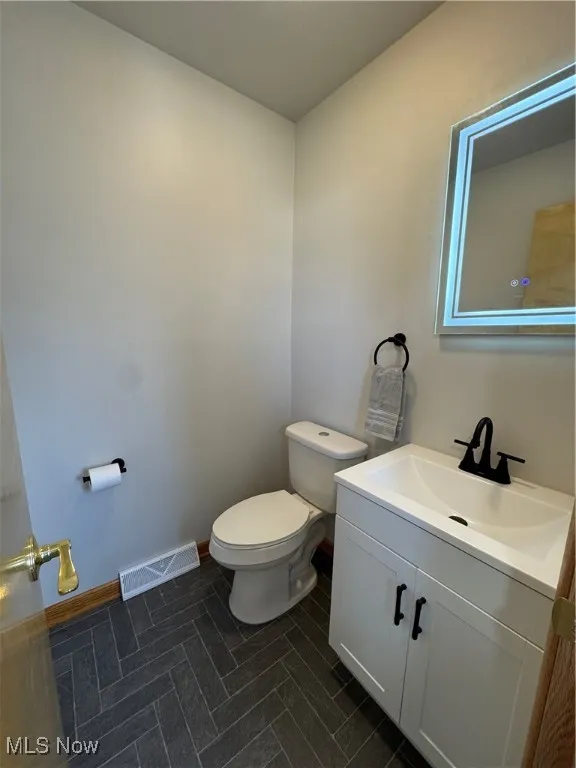 All New Half bathroom off kitchen near rear deck entry