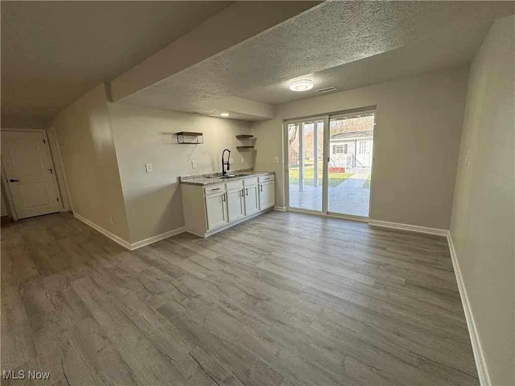 Rec room could be made into an Accessory Dwelling Unit.  Housemate? Elderly parents? College student? Traveling nurse? The possibilities are endless