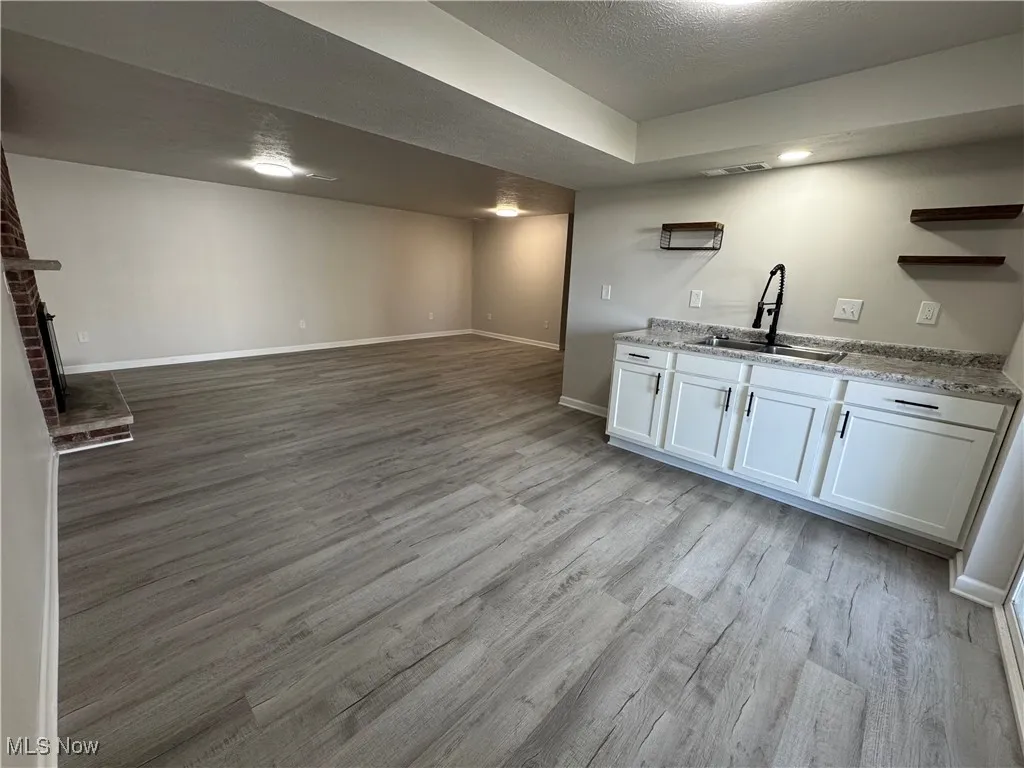 Walk out basement to lower level patio, yard, storage buildings