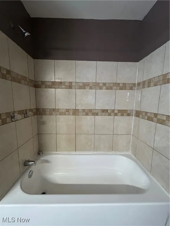 Full bathroom with  shower combination