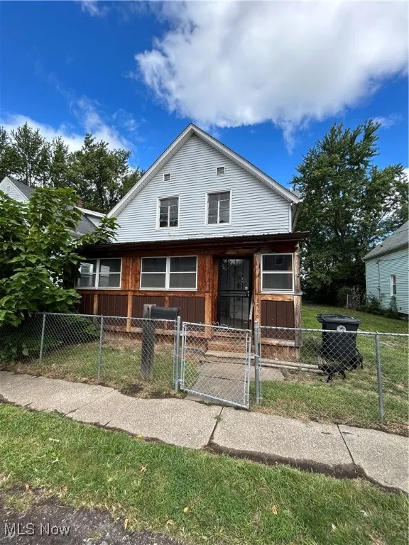 View of front of property with a gate and a fenced front yard