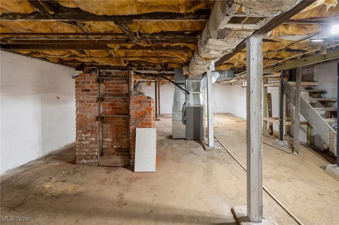 Unfinished below grade area with heating unit