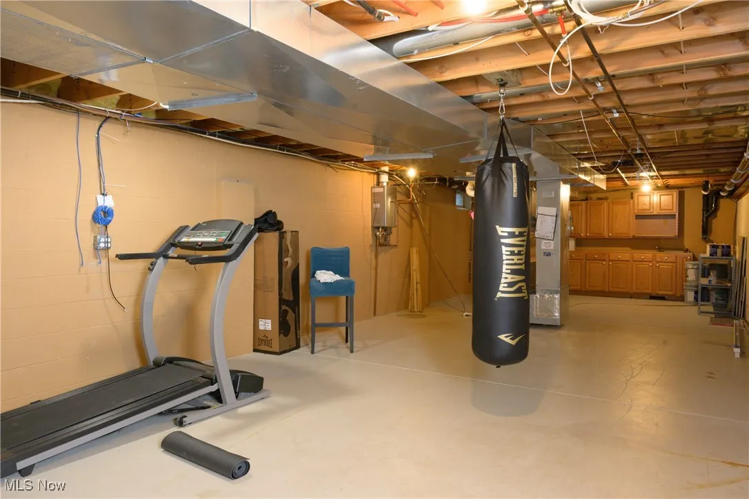 Workout room featuring concrete block wall