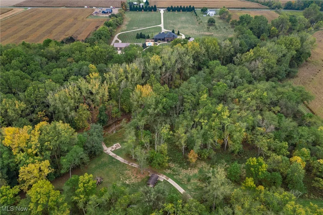 Birds eye view of property with a rural view