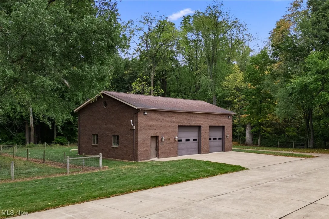 Garage featuring fence